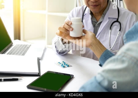 Doctor take care and give consult to the patient with tablet screen clipping path Stock Photo