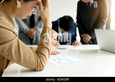 businesswoman boss head leader feel upset when worker do mistake and all the man feel sad Stock Photo