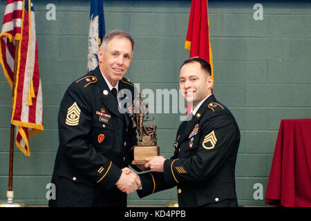 Staff Sgt. Jesse Mullinax, 218th Regional Training Institute, receives his trophy for being the top noncommissioned officer competitor. He will go on to represent S.C. in the regional competition. Stock Photo