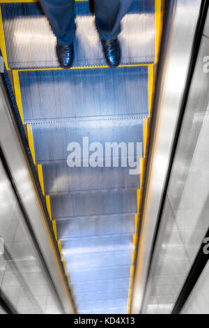Risky Business Decision Concept Man On Tall Escalator Stock Photo