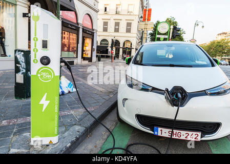Brussels, Belgium - August 27, 2017: Electric car recharging batteries at a recharge point of the company Zen Car on a street in Brussels, Belgium Stock Photo