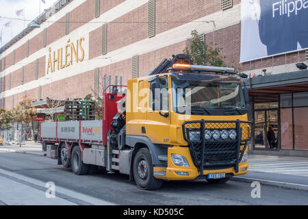 stockholm, Sweden- October 5, 2017: Yellow Construction truck on a central street in stockholm Stock Photo