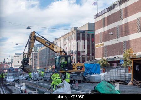 stockholm, Sweden- October 5, 2017: Construction on a central street in stockholm several people working on the site Stock Photo