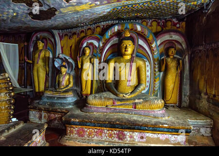 Images of meditating Buddha in Dambulla Stock Photo