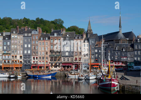 The Norman coast in the area called 'Cote Fleurie - cote de Grace': facade of old buildings in the Old Port of Honfleur. Picturesque corbelled houses  Stock Photo