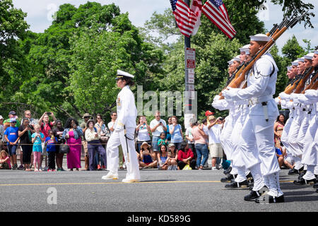 WASHINGTON DC-May 25, 2015: Memorial Day Parade. A marching platoon of United States Navy enlisted soldiers wearing full dress white ceremonial unifor Stock Photo