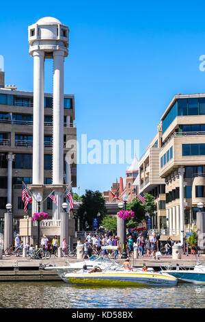 WASHINGTON DC-May 24, 2015: Georgetown waterfront viewed from the Potomac River on a sunny summer day. Bustling with crowds of people there for the re Stock Photo