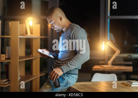 Profile photo of serious man that watching video Stock Photo