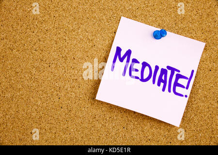 A yellow sticky note writing, caption, inscription unplug, motivational lifestyle reminders against black ext on a colorful sticky note pinned to a cork notice board Stock Photo