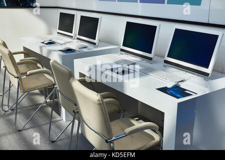 Modern workplaces with computers for company employees Stock Photo