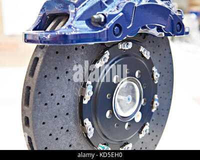 Front monoblock six piston aluminium caliper and carbon ceramic brake disc Stock Photo