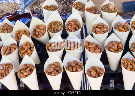 cones with delicious sugared peanuts on market Stock Photo
