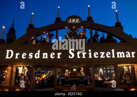 The decorated gate to the Christmas Market in Dresden, Germany. Traditional Christmas Markets Dresden Striezelmarkt at Sunset. Stock Photo