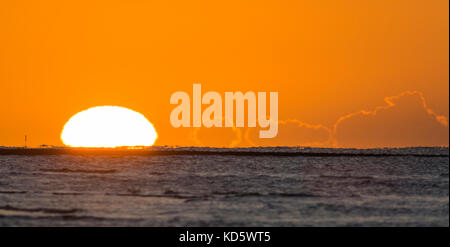 Sun rising over the sea. Sunrise over the ocean. Stock Photo