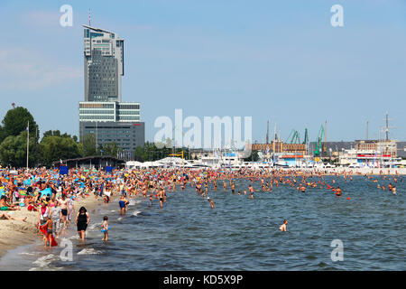 GDYNIA, POLAND - AUGUST 2, 2015: Crowded public beach in Gdynia on Baltic sea Stock Photo