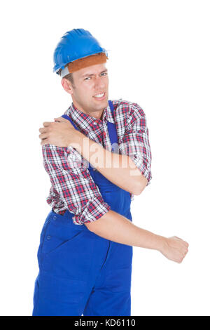 Portrait Of A Worker With Shoulder Pain Isolated On White Background Stock Photo