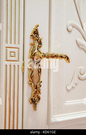 White door with golden lock Stock Photo