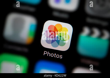 A close-up shot of the Photos app, as seen on the screen of an Apple iPhone (Editorial use only) Stock Photo