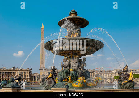 Paris (France): the Maritime Fountain and the Obelisk in the background in the square 'place de la Concorde', in Paris 8th arrondissement / district ( Stock Photo