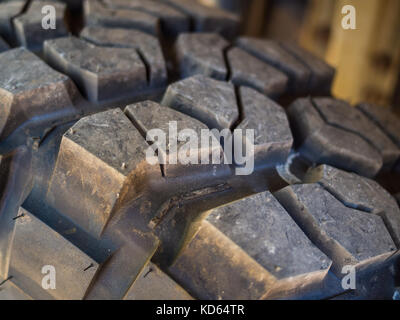 Closeup of aggressive offroad mud tire tread on 4x4. Stock Photo