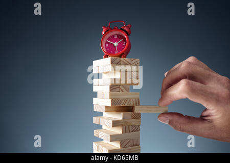 Planning, risk and strategy deadline time in business alarm clock on wooden blocks Stock Photo