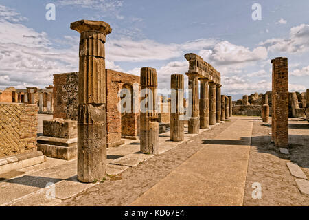 Columns at the Forum area in the ruined Roman city of Pompeii at Pompei Scavi near Naples, Italy. Stock Photo