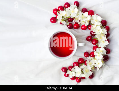 Cherry tea and fruit flatlay top view Stock Photo
