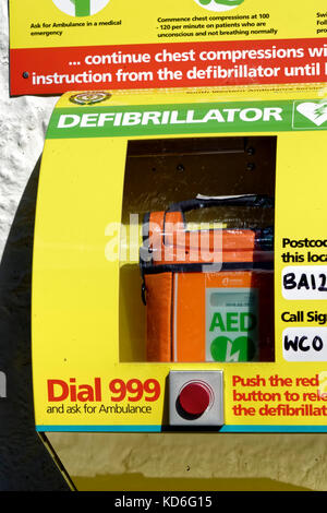 A Public Access Defibrillator attached to the outside wall of the Bath Arms Pub in Crockerton, Wiltshire, United Kingdom Stock Photo