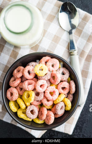 Colorful cereal rings and milk. Stock Photo