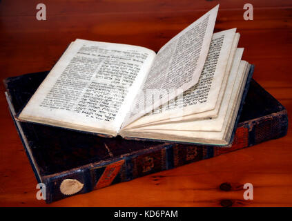 Gemara or Talmud - open page showing post-exilic (4th to 8th century) rabbinic commentary on the Mishnah (central text), surrounded by explications of 11-12th century rabbis, Rashi and the Tosafists. Photo shows 19th century printed version in traditional layout Stock Photo