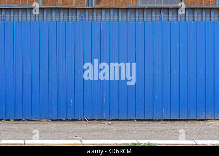Corrugated steel metal blue fence exterior Stock Photo - Alamy