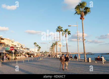 Tourists on the promenade in Kato Paphos, Paphos, Cyprus Stock Photo