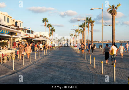 Tourists on the promenade in Kato Paphos, Paphos, Cyprus Stock Photo
