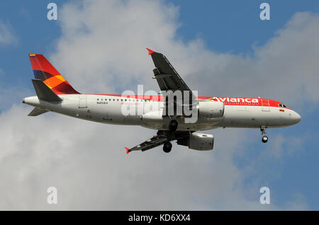 Miami, USA - November 21, 2010: Avianca passenger jet airplane landing at Miami International Airport. Avianca is the national airline of Colombia and Stock Photo