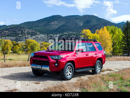 Red 2014 Toyota 4Runner Trail Premium on four wheel drive 4WD road, Central Colorado, USA Stock Photo