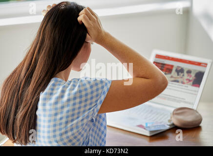Woman banking online Stock Photo