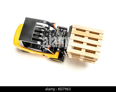 Forklift truck carrying stacked wooden pallets shot from above on white background Stock Photo