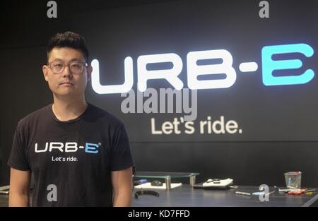 Los Angeles, California, USA. 18th Sep, 2017. Chief Executive of URB-E, Peter Lee with their foldable electric scooter. Credit: Ringo Chiu/ZUMA Wire/Alamy Live News Stock Photo