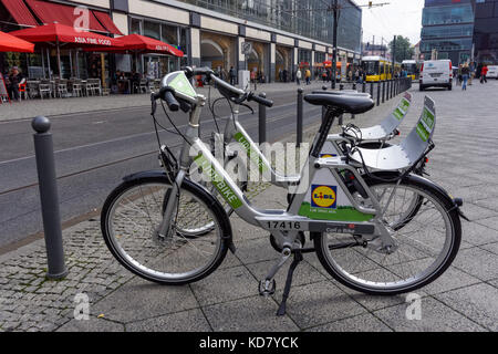 Bicycles for hire parked at Alexanderplatz in Berlin, Germany Stock Photo