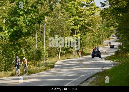 Winding, curvy road in Door County, Highway 42, near Death's Door and ferry departure point for Washington Island. Traffic coming from ferry. Stock Photo