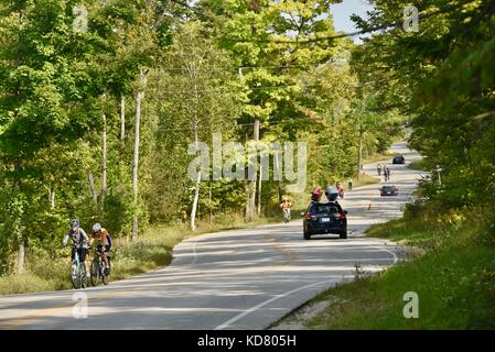 Winding, curvy road in Door County, Highway 42, near Death's Door and ferry departure point for Washington Island. Traffic coming from ferry. Stock Photo