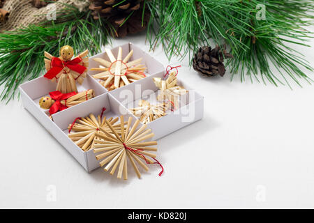 Happy New Year greeting card. Frame, border. Green Christmas tree, toys, pine cones on a white background. Stock Photo