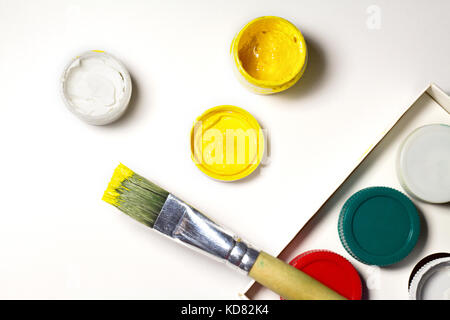 Colorful Paint Brushes with the yellow Colors. Stock Photo