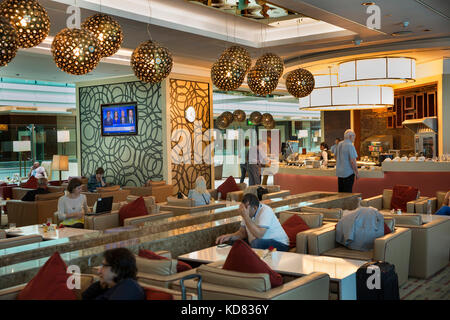 UAE, Dubai international Airport, transit passengers in Emirates Airlines Business Class Lounge, Stock Photo