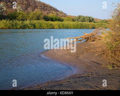 Landscape view over beautiful Kunene River which seperates Namibia and Angola, Southern Africa.