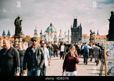 Prague, Czech Republic - September 22, 2017: Crowd Of Tourists Walking On Charles Bridge In Sunny Autumn Day Stock Photo