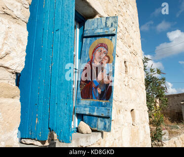 painted window shutters on the side of the Arts centre in Kouklia village in Paphos region, Cyprus Stock Photo
