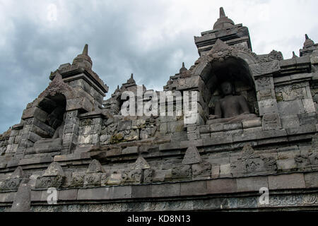 Statues of seated Buddha in the niches of the Borobudur Temple, Jogjakarta, Indonesia Stock Photo