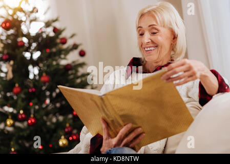 Beautiful blonde reading fairy tales Stock Photo