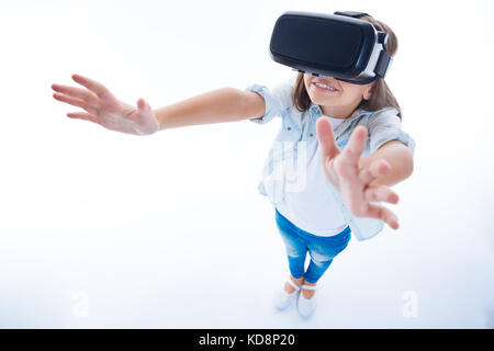 Positive pretty girl using new technologies Stock Photo